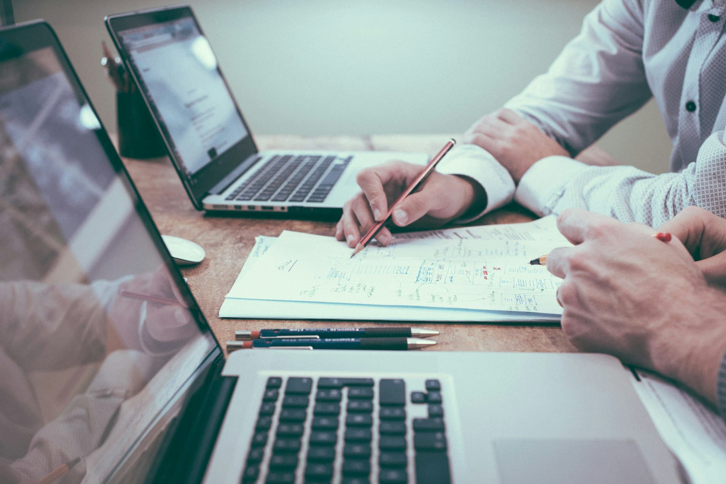 Strategy documents and financial planning papers on a desk